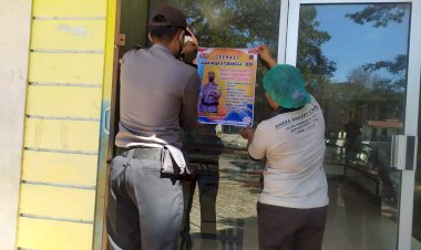 Pemasangan-poster-imbauan-di-tempat-area-publik-di-lakukan-aman-nusa-II