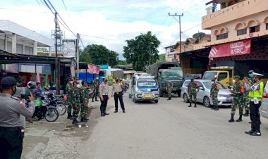 Kodim-1618-TTU--Dan-Polres-TTU-lakukan--Kegiatan-Penyemprotan-Disenfektan-Dan-Operasi-Aman-Nusa-II